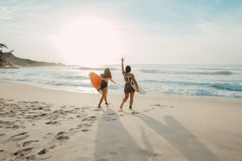 Surfers on a beach in Goa. Source: Unsplash